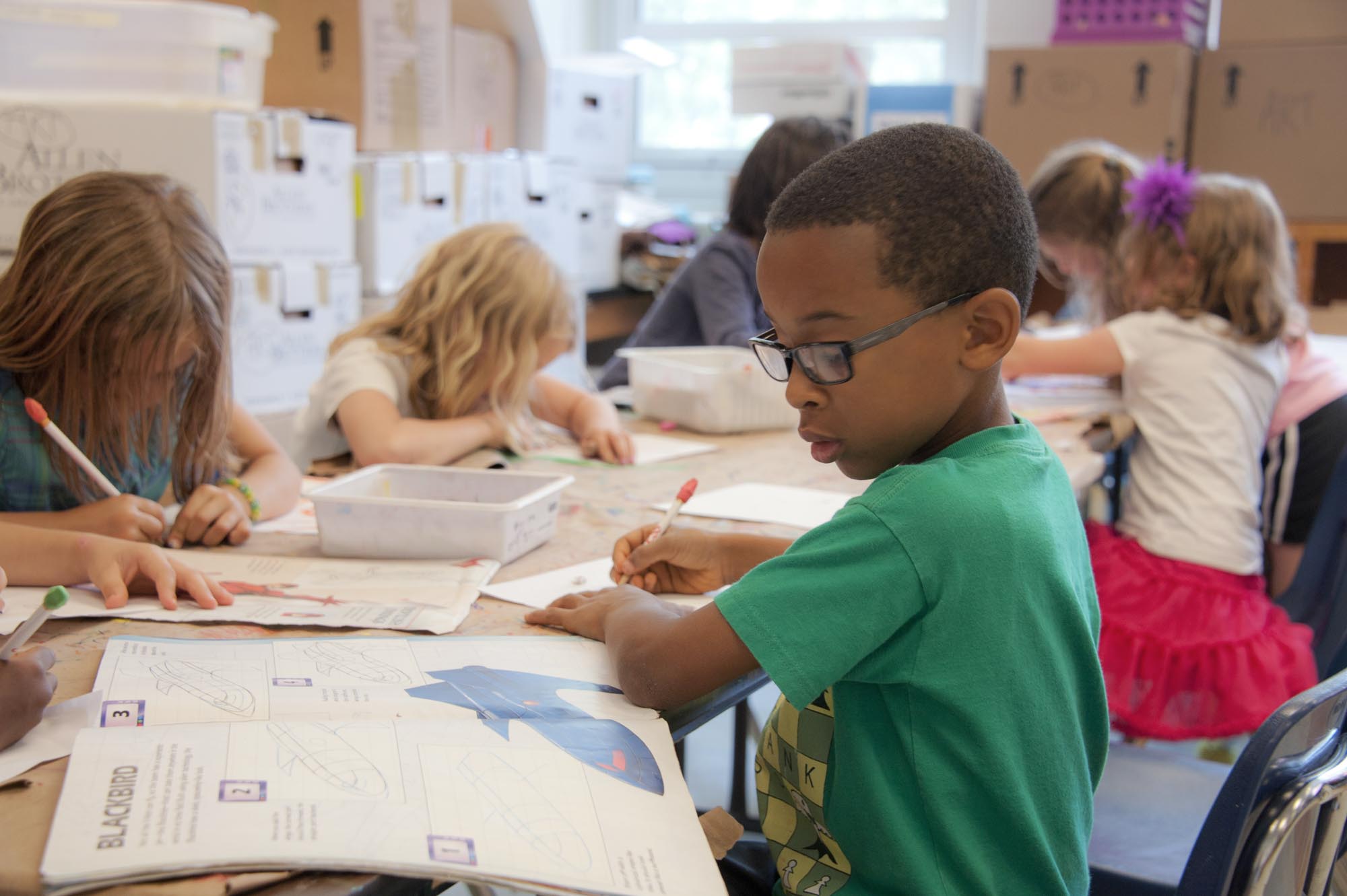 Young students reading at the museum